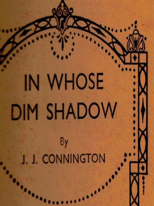 Couverture ebook de In Whose Dim Shadow, de J. J. Connington