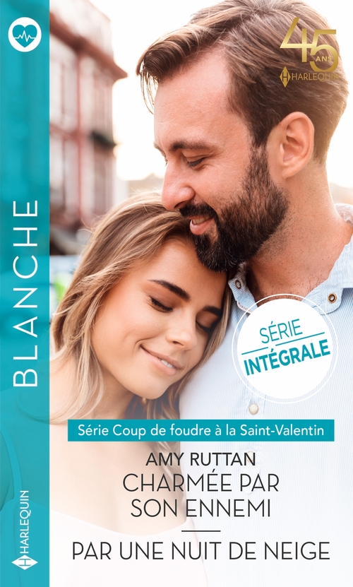 Couverture ebook de Charmée par son ennemi - Par une nuit de neige, de Amy Ruttan